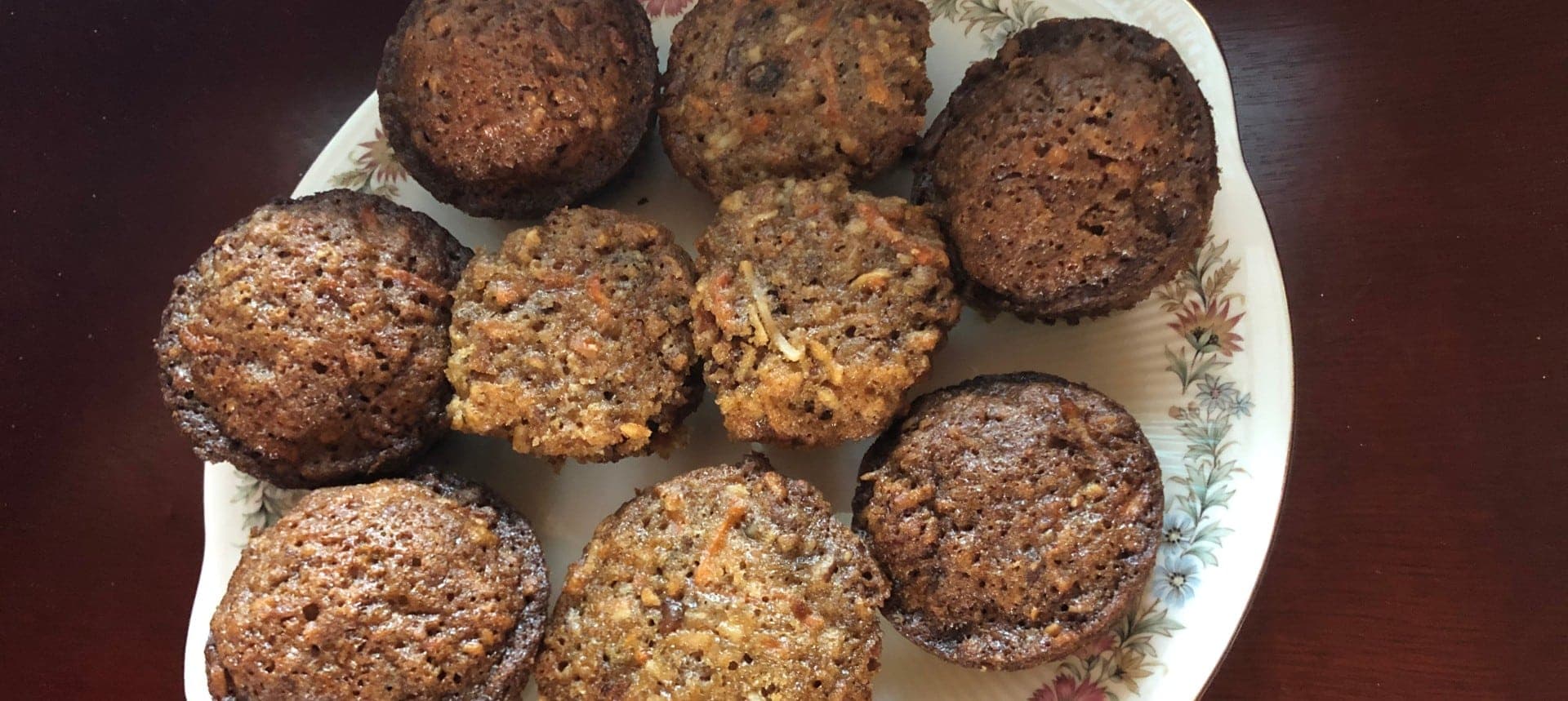 A plate of freshly baked muffins in various textures and colors.