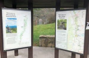 Two informational maps on a shelter, welcoming visitors to Shenandoah National Park and the Blue Ridge Parkway.