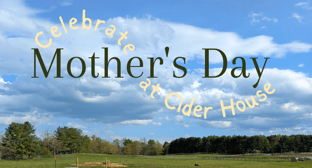 Green pasture with grazing cows and a fence under a blue sky; overlay reads 'Celebrate Mother's Day at Cider House'.